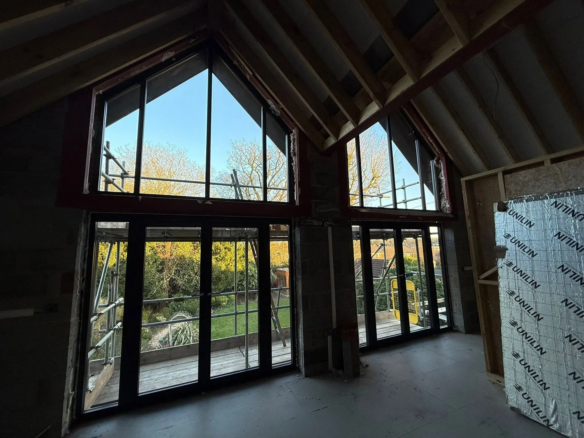 Full-height glazing in a vaulted extension seen from inside