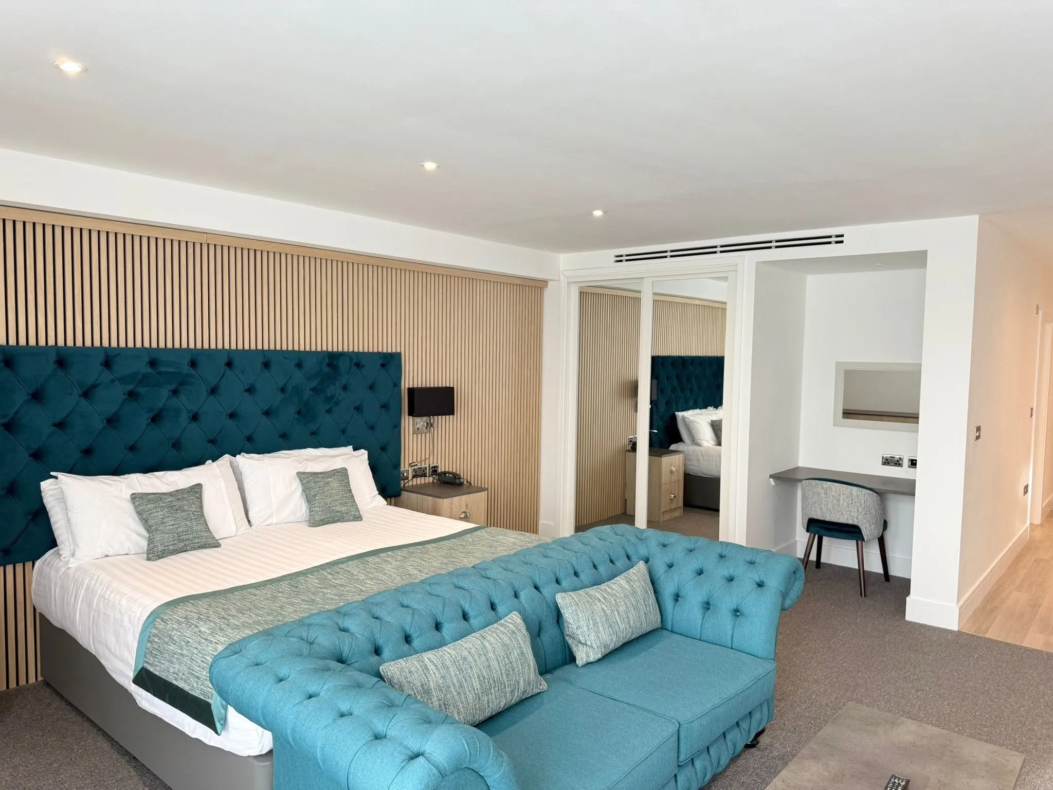 Bedroom renovation with a fitted headboard and new decoration