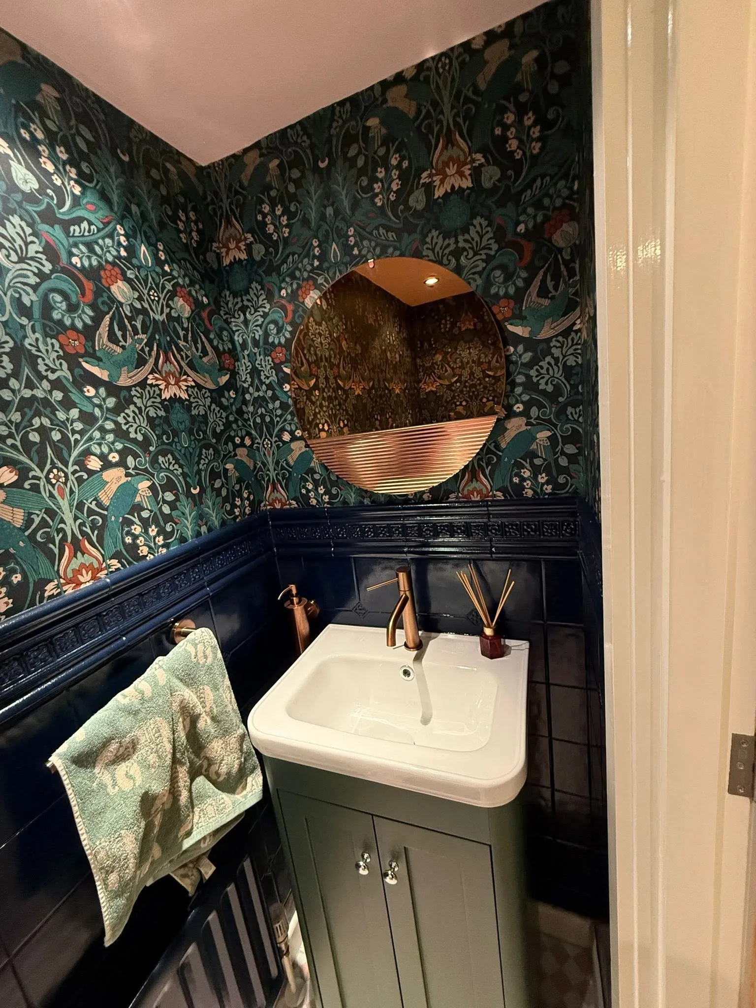 Cloakroom refurbishment with panelling and a wall-hung basin