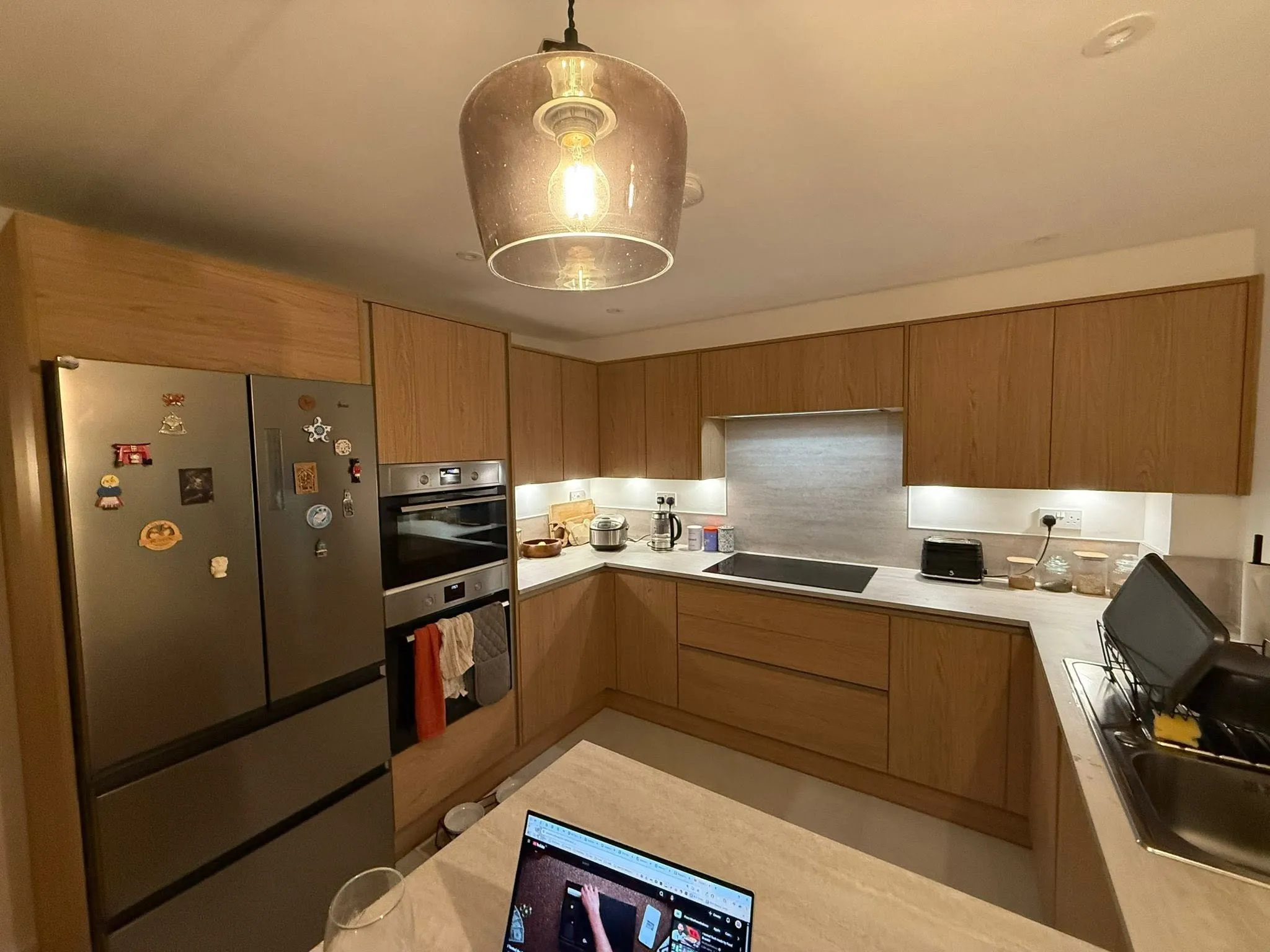 Fitted kitchen with a large island and integrated appliances