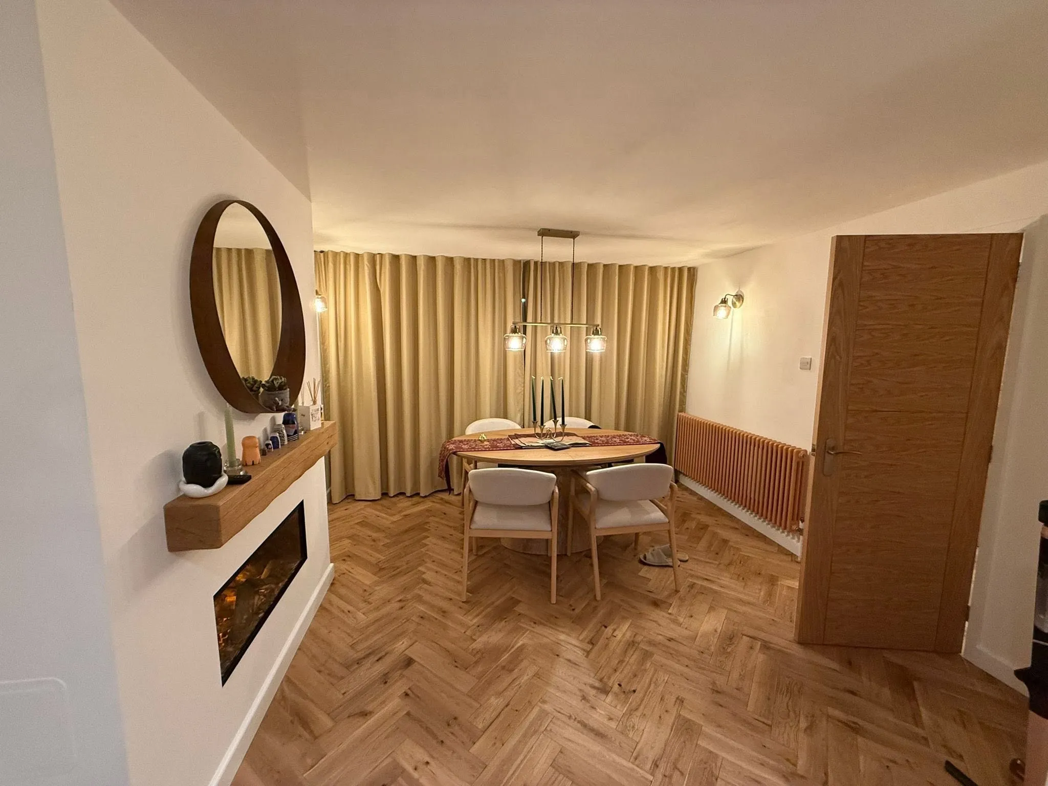 Hallway with new panelling and a mirror after renovation