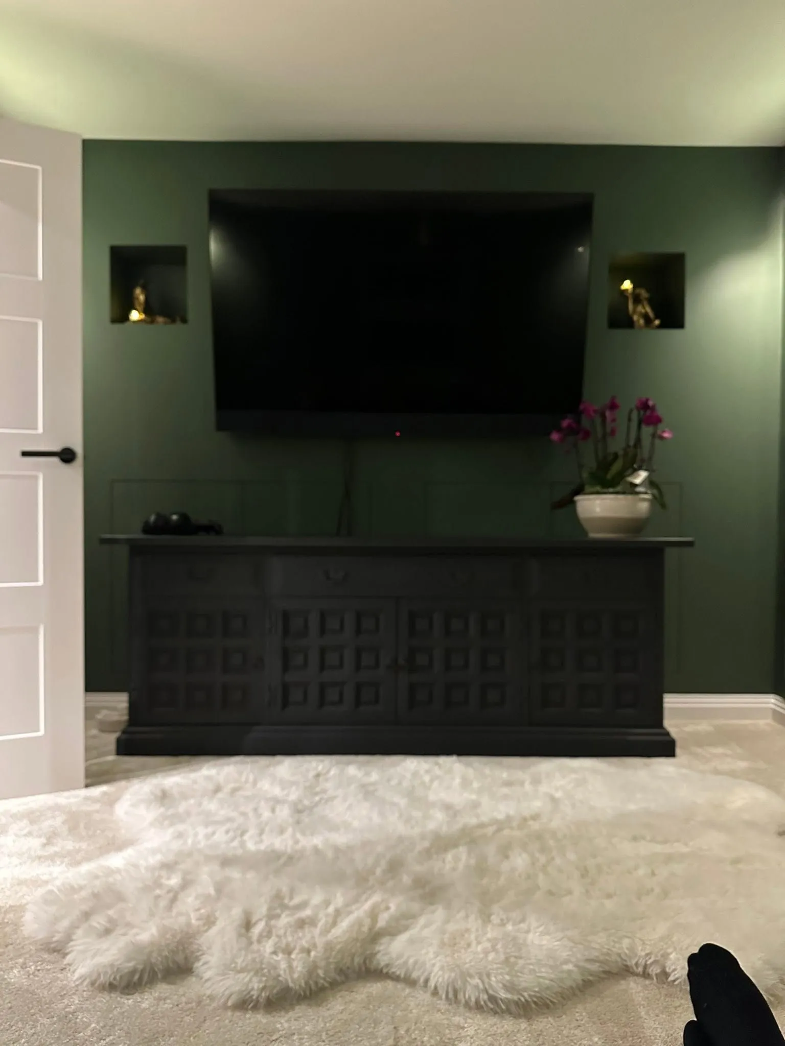Dark panelled media wall built into a living room