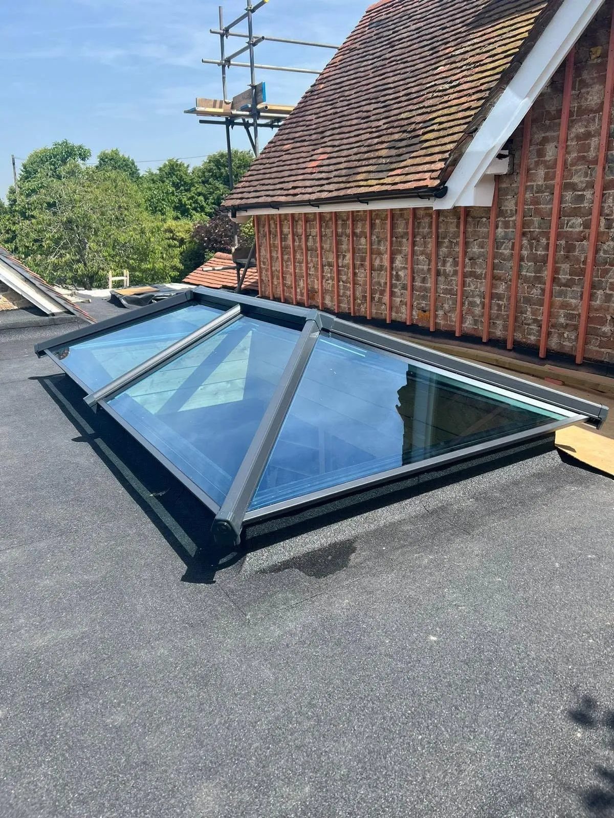 Glass roof lantern installed in a flat roof extension