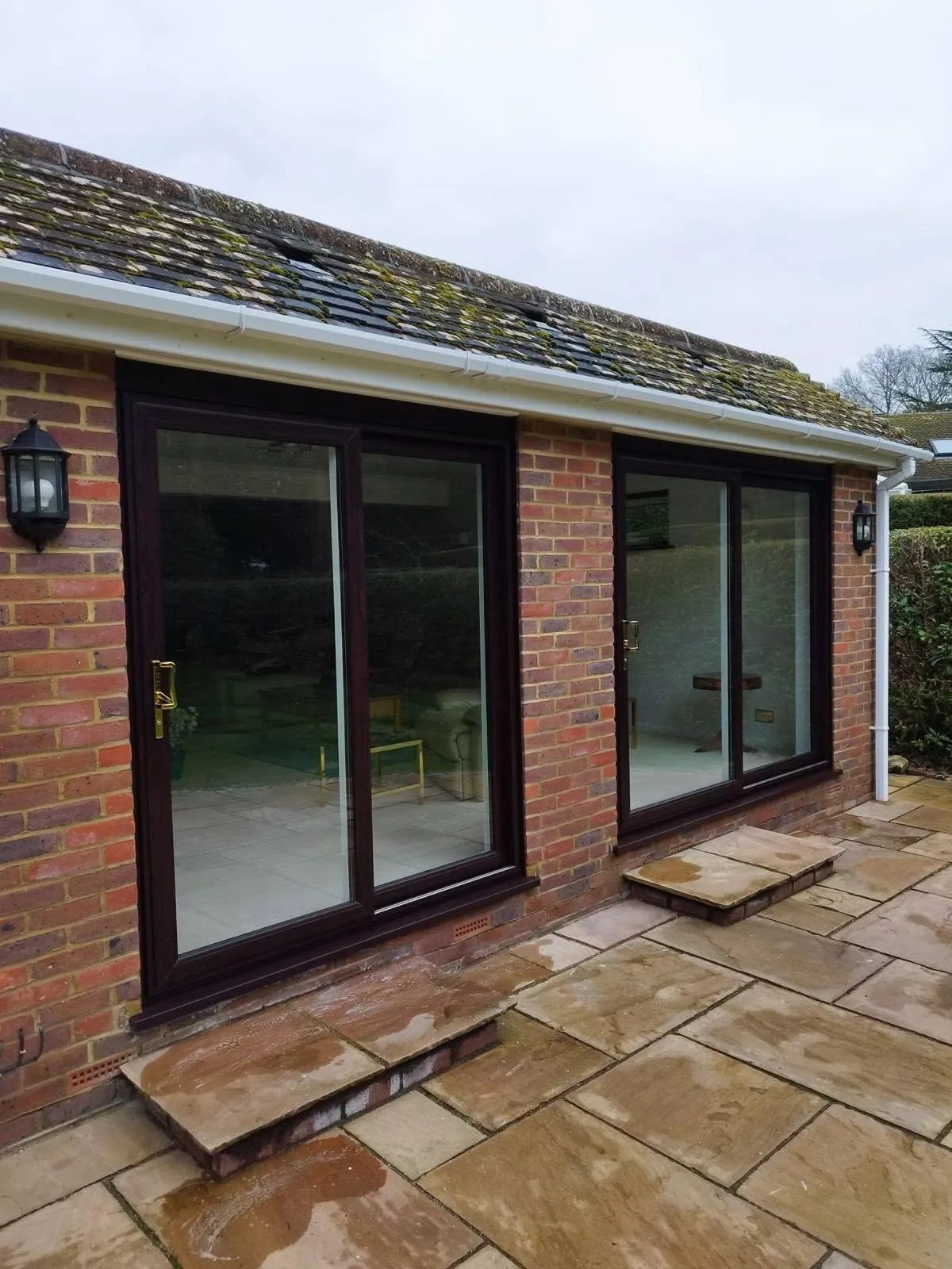Sliding doors along a single storey extension
