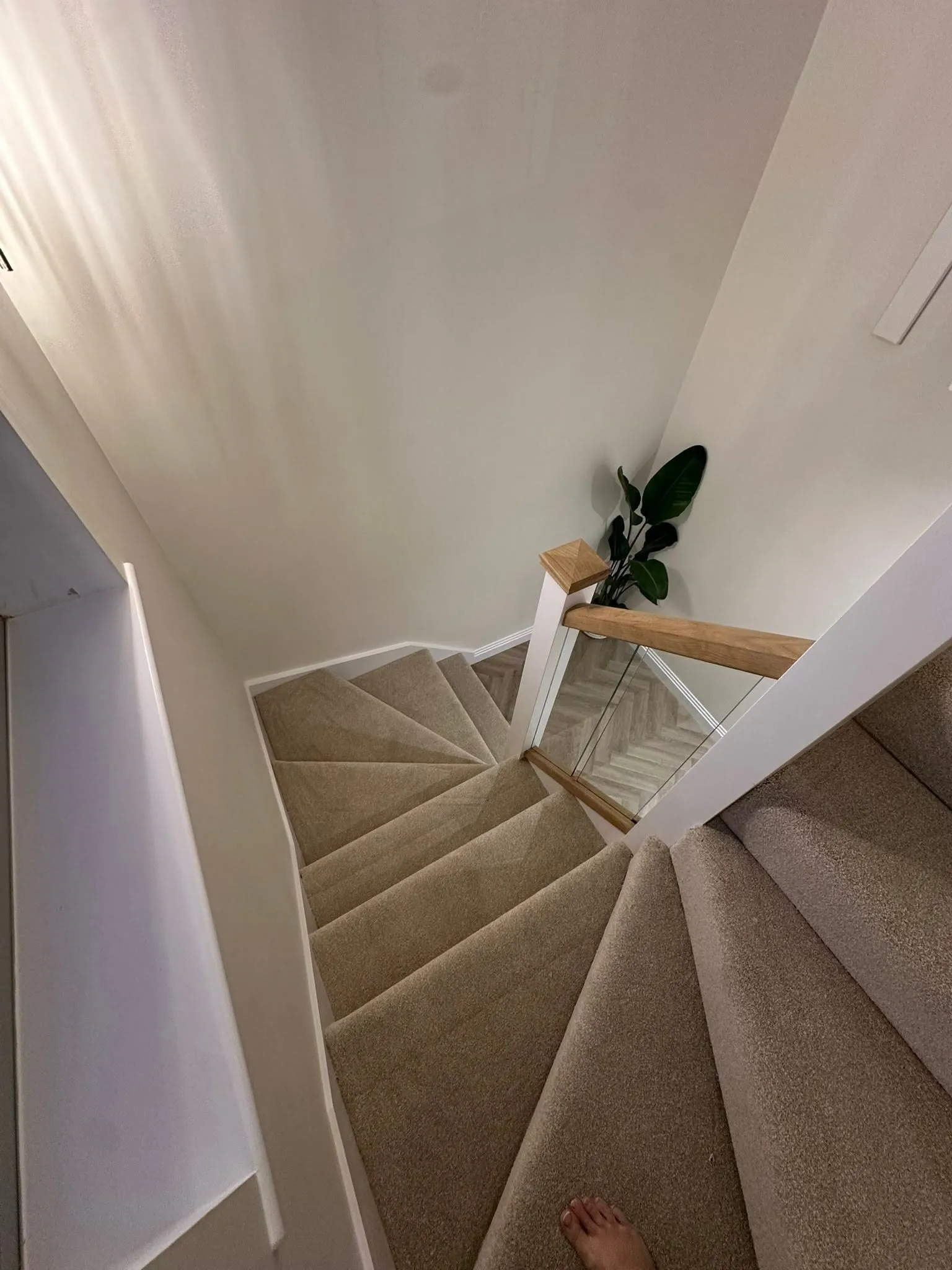 Redecorated staircase and landing in white
